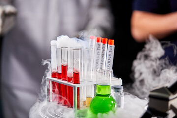 close-up photo of blood in tube samples and vaccine, prepared tools for making research, healthcare medical concept
