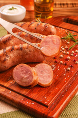 Brazilian BBQ fork serving pork sausage - Churrasco de linguiça de suina close up