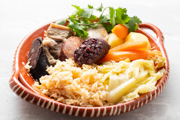 typical portuguese dish cozido a portuguesa on ceramic dish