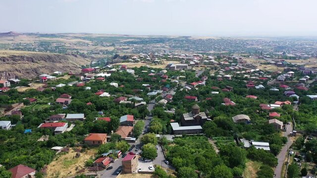 High angle drone shot of Saint Gevorg monastery of Mughni, Armenia. Aerial 4k footage of monastery
