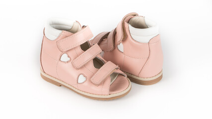 children's beige orthopedic sandals on a white background