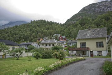 Fototapeta na wymiar The village of Eidfjord in Norway is a major cruise ship port of call. It is situated at the end of the Eid Fjord, an inner branch of the large Hardangerfjorden
