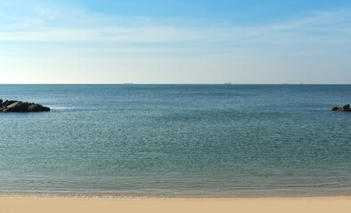 On the beach, the sea has waves, wind and sunshine. Happy with vacations and holidays