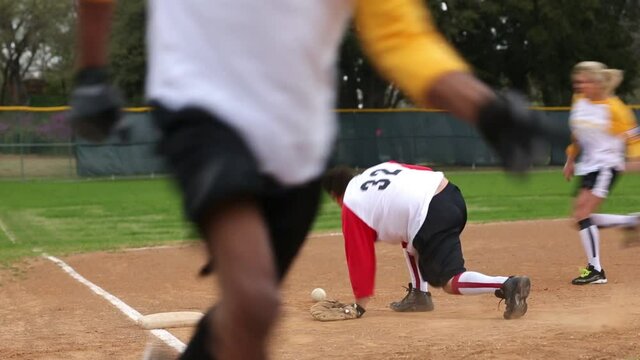 Hispanic man bobbling baseball and opposing team scores
