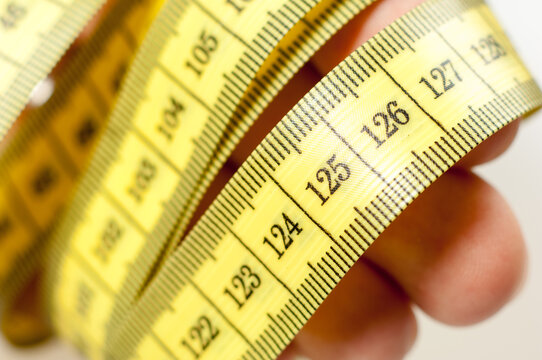 Tape measure wrapped around hands