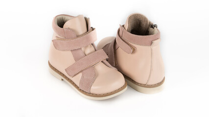 children's beige high orthopedic lacing shoes on a white background