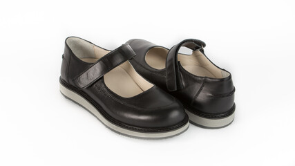 children's black orthopedic sandals on a white background