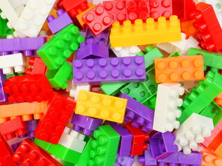 Pile of child's building blocks in multiple colours.