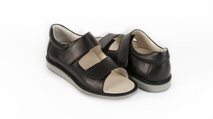 children's black orthopedic sandals on a white background
