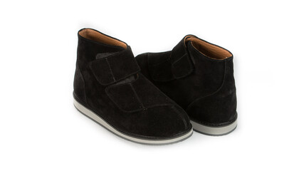 children's black orthopedic shoes on a white background