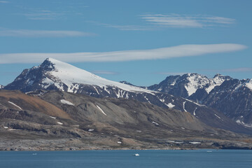 Mountains, glaciers and coastline landscape close to a village called 