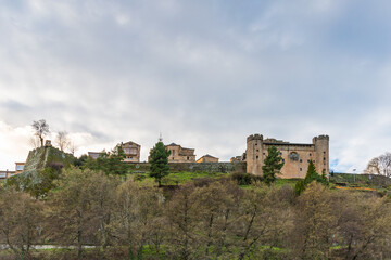 Fototapeta na wymiar Panoramic view of Puebla de Sanabria, original stone wall, castle, church and houses. Listed as one of the most beautiful villages in Spain