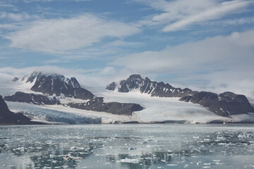 Mountains, glaciers and coastline landscape close to a village called 