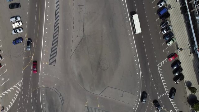 Cars drive on the road, view from above. Parking and asphalt. Road markings. Zhytomyr. Ukraine. Europe