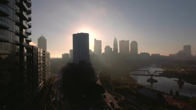 Drone aerial establishing shot of downtown city of Columbus, Ohio buildings during a contrast heavy, early morning fog in the cold, fall weather 2020