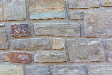 bright mediterranean stone wall with copy space, background.