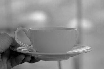 black and white of close up a white coffee cup 