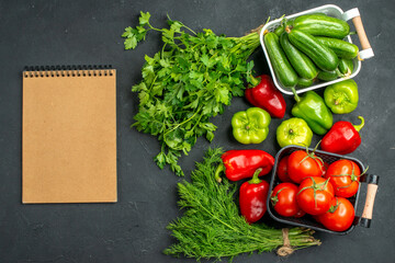 top view fresh red tomatoes with greens and bell-peppers on a dark background meal salad color photo ripe
