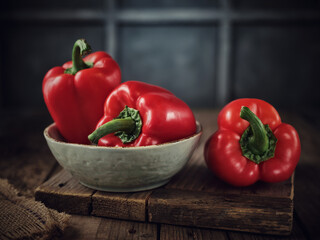 Red peppers (paprika) in a plate on the table