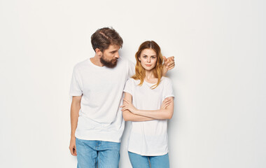 Man and woman stand next to t-shirts family casual wear lifestyle