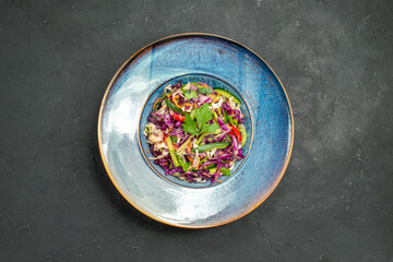 Obraz na płótnie Canvas top view fresh cabbage salad inside plate on a dark background salad meal food health diet ripe
