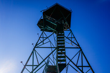 High forest watchtower on top of a peak.