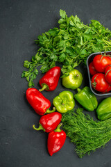 top view fresh red tomatoes with greens and bell-peppers on dark background color photo ripe meal