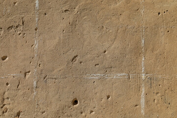 Empty beige stone wall looks like dry sand effect, background with space for text, no person 