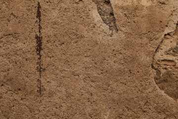 brown ancient stone wall with cracked surface, no person and space for text, background or template