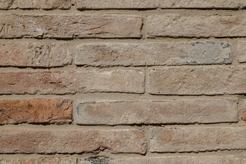 Weathered stone wall with peeled effect, rough stone structure, background with space for text
