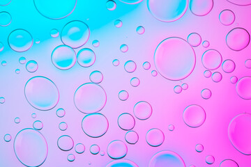 Vivid neon background with bubbles. Colorful abstract backdrop with bright gradients on blobs. Blue and pink overflowing colors