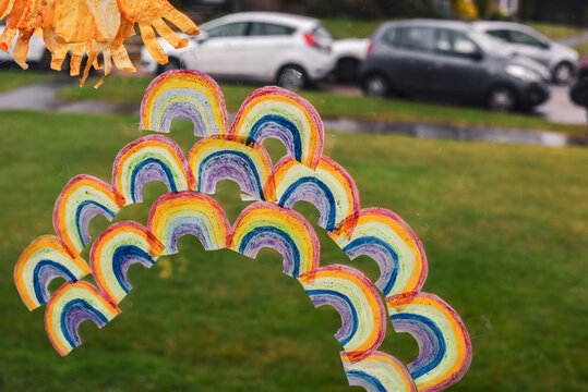 Rainbows Stuck To A Window By Children During Winter Lockdown In Tier 4 As A Second Wave Of Coronavirus Is In England Causing People To Stay At Home