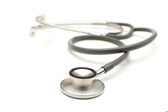 Closeup of old vintage black stethoscope isolated on white background. Healthy lifestyle concept. 