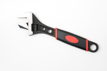 Adjustable wrench on a white background