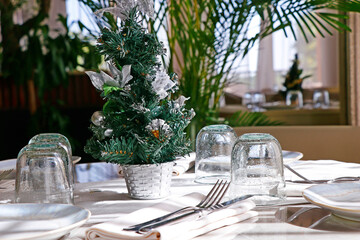 Beautifully decorated Christmas tree with dining table set up