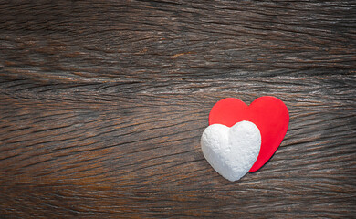 couple of hearts on wooden background