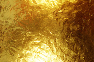 Shiny gold foil background texture.