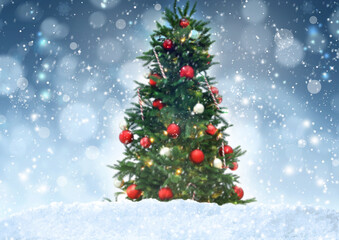 Fototapeta na wymiar Beautiful decorated Christmas tree and snow against blurred festive lights. Bokeh effect