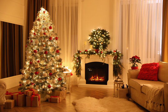Festive living room interior with Christmas tree and fireplace