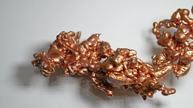 Panning view of a native copper resemble like a dragon isolated on the white background.