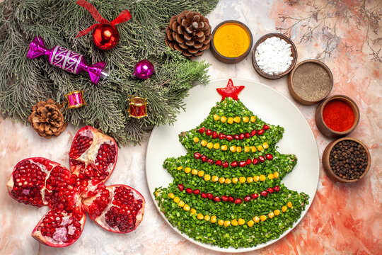 top view tasty green salad in new year tree shape with seasonings on light background color holiday photo meal xmas
