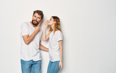 Cheerful man and woman t-shirts studio family lifestyle