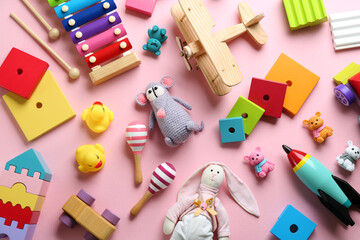 Different toys on pink background, flat lay - obrazy, fototapety, plakaty