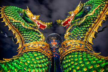 Fototapeta premium Wat Khao Phra Kru,Landmark of sriracha city with two of great Nagas guarded entrance to the view point and the crystal ball that gives an inverted view of the Sriracha scenery,Chonburi,Thailand