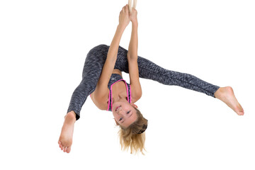 Girl flipping upside down on gymnastic rings