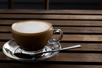 Hot coffee on the wooden table