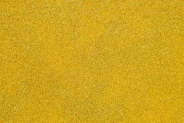 Yellow glitter texture abstract background for Christmas theme idea design concept