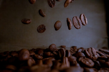 Closeup shot to falling coffee beans with selective focus