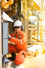Technician,Instrument technician on the job calibrate or function check pneumatic control valve in process oil and gas platform offshore,technician,