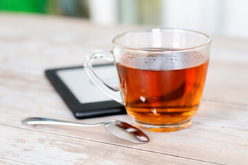 A cup of black tea and ebook